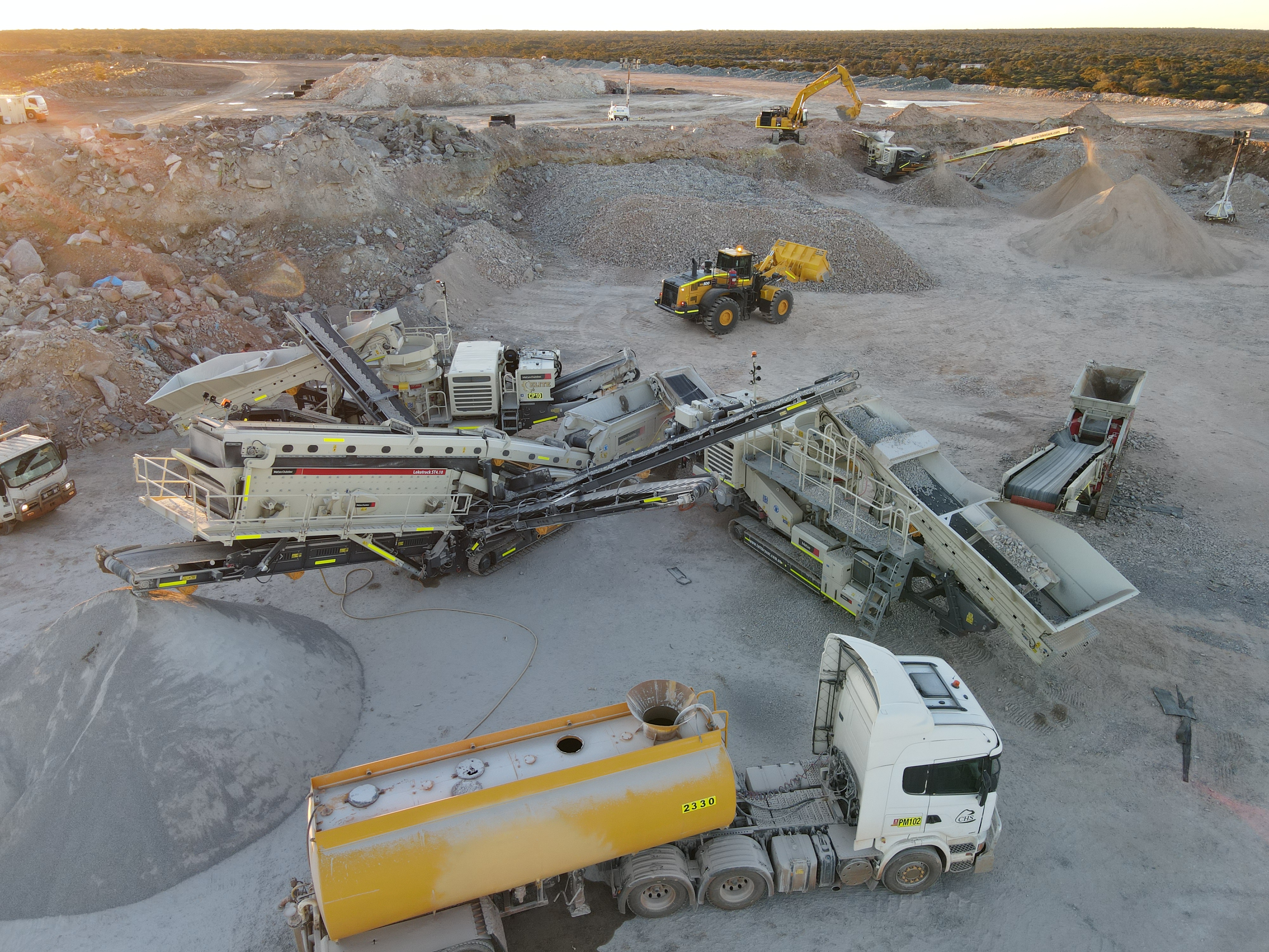 Aerial view of an EMCCS full mobile crushing train operating in WA at golden hour