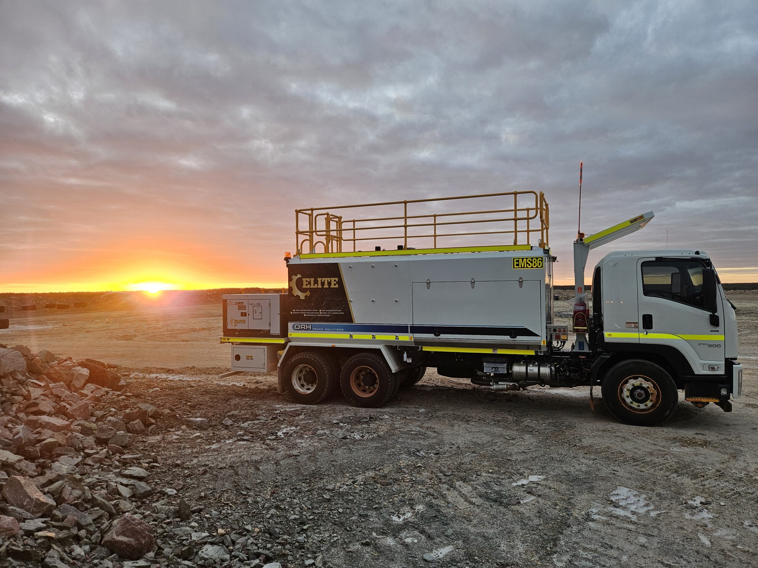EMCCS service truck on a Pilbara mine site at sunset