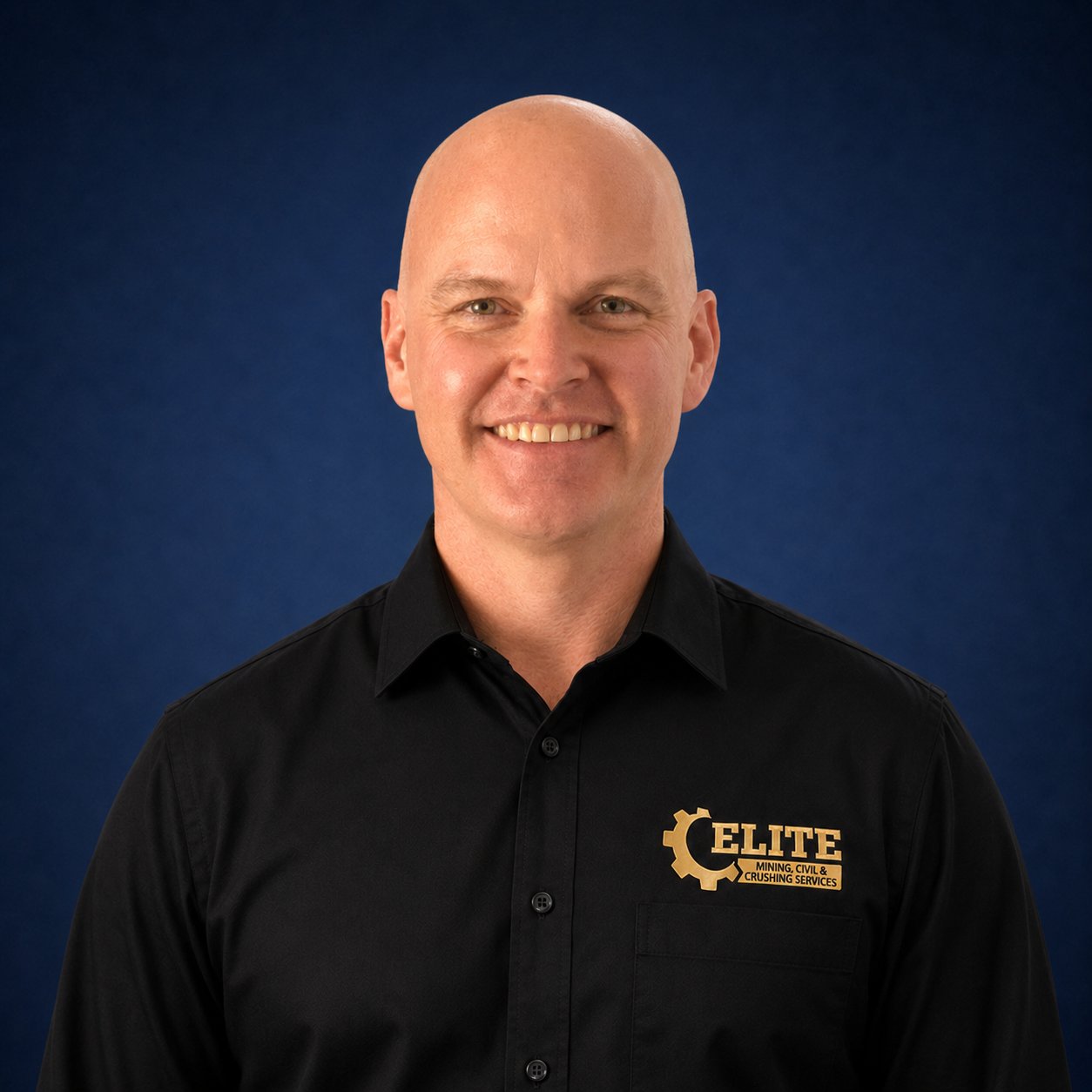 Michael Cleveland, General Manager at EMCCS, professional studio portrait in Elite-branded polo